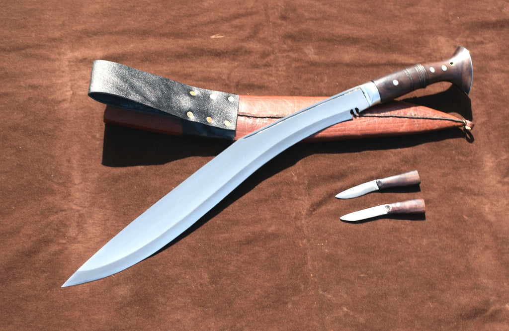 Sirupate Kukri knife laid flat showing blade spine, rosewood handle, brown leather sheath, and two karda knives – Grace Kukri House