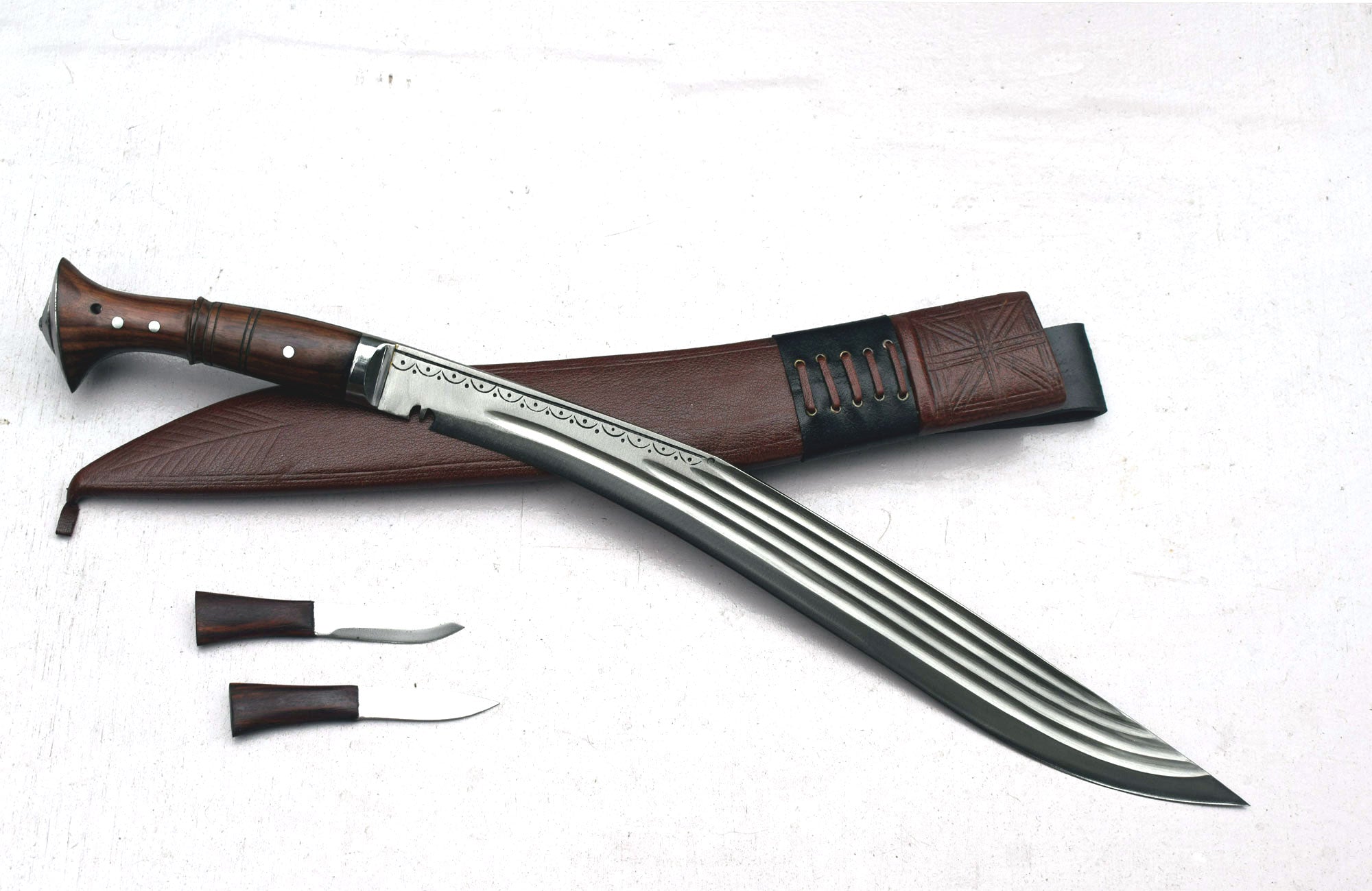 Full tang Sirupate Kukri 18 inch blade with fullers, engraved bolster, brown leather scabbard and utility knives – Grace Kukri House