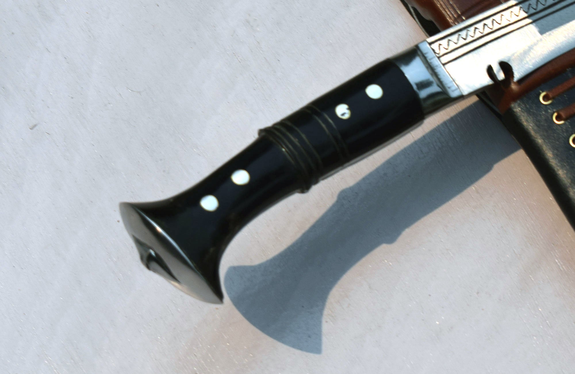Handcrafted Sirupate kukri knife with buffalo horn handle displayed for scale