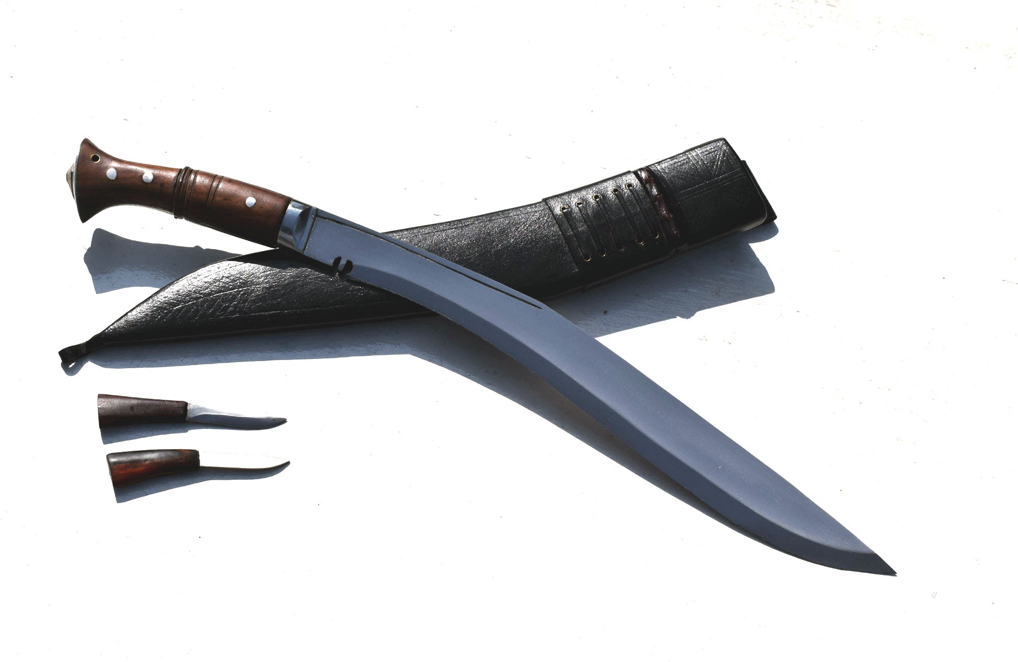 Sirupate Kukri knife angled view with rosewood handle, black leather sheath, and karda knives – Grace Kukri House